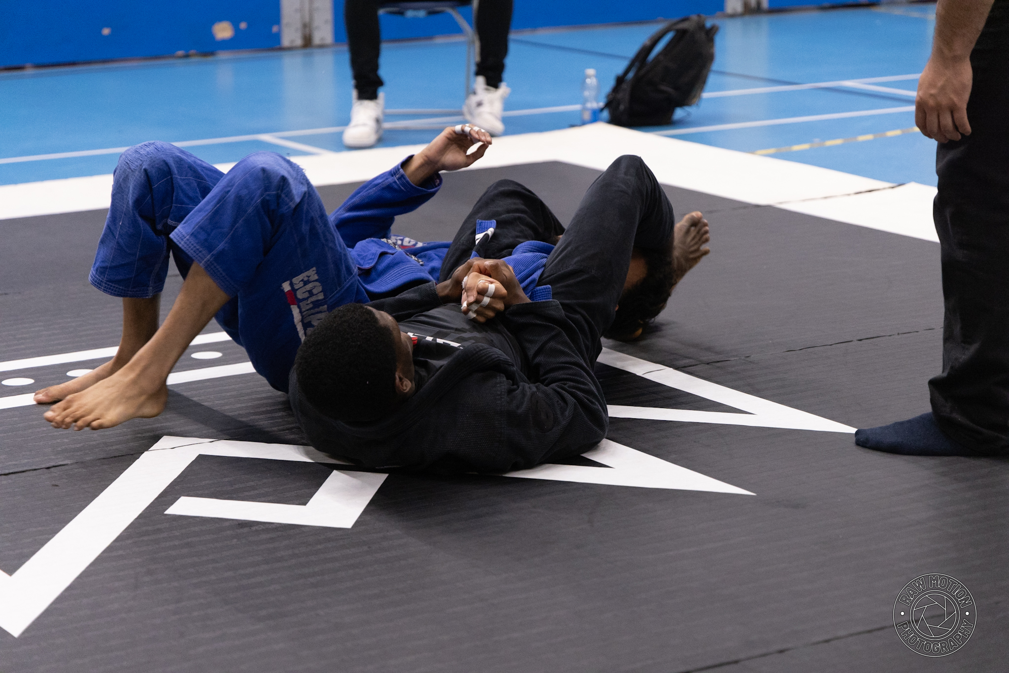 Sheyin performing an armbar in Brazilian Jiu-Jitsu competition
